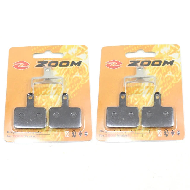 https://ae01.alicdn.com/kf/S0025bc7ede63423bb9fb306cfcc380240/ZOOM-DB-03-Semi-Metal-Hydraulic-Oil-Disc-MTB-Bike-Brake-Pads-For-M355-M375-M395.jpg